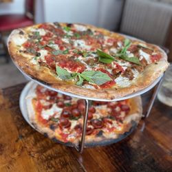Pizzeria La Rosa - Half eggplant and half meatball ricotta on top and a margarita with "pepperoni cups" on bottom.