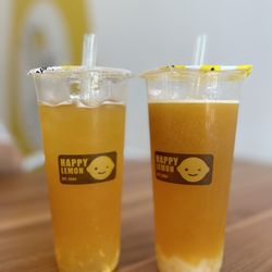 Happy Lemon - Mango green tea (E11) and Passionfruit Mango green tea (S1)  (ignore the gap at the top we took a few sips)