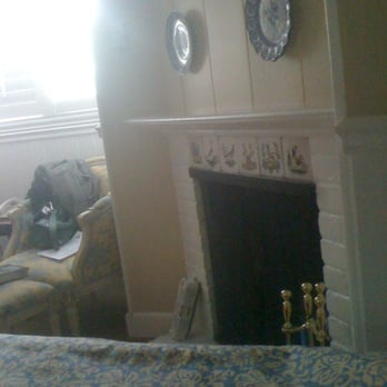 The Normandy Inn - Fireplace next to the bed - Hotels Near Me - Carmel, California The Normandy Inn - Fireplace next to the bed - Hotels Near Me - Carmel, California