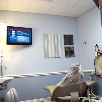 Brush Dentistry - Treatment room with TVs on the ceiling and wall for your enjoyment - General Dentistry Near Me - Saginaw, Texas