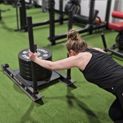 Evolve Fitness Studio - Member Michele Crushing Sled pushes