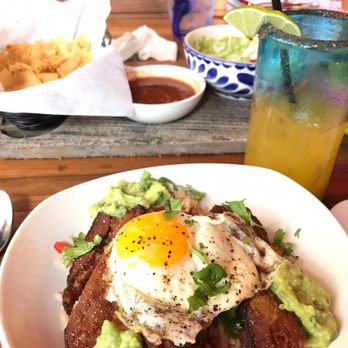 Nada - Guacamole and chips, Crispy Pork with egg over rice! And Mango Chile Cocktail - Mexican Near Me - Cincinnati, Ohio Nada - Guacamole and chips, Crispy Pork with egg over rice! And Mango Chile Cocktail - Mexican Near Me - Cincinnati, Ohio