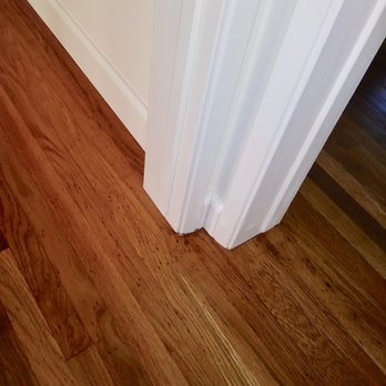 New Millennium Floors - a hardwood floor in a home - Flooring Near Me