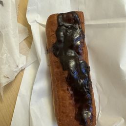 Chocolate long John with cream filling. The filling is always full and delicious, however the chocolate is always like this or worse. Chocolate long John with cream filling. The filling is always full and delicious, however the chocolate is always like this or worse.