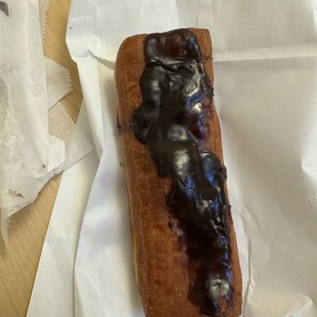Scent From Heaven Bakery - Chocolate long John with cream filling. The filling is always full and delicious, however the chocolate is always like this or worse. - Bakeries Near Me - Portsmouth, Ohio Scent From Heaven Bakery - Chocolate long John with cream filling. The filling is always full and delicious, however the chocolate is always like this or worse. - Bakeries Near Me - Portsmouth, Ohio