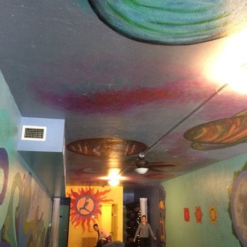 Warrior One - Contemplate the solar system as you unwind. - Yoga Near Me - Orlando, Florida