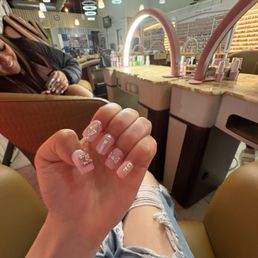 unprofessional. the owner has the child running all over the place . nails were ugly . waste of 235