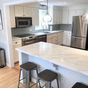 Capital Granite and Marble - Beautiful Calacatta Luccia quartz on a remodeled kitchen! - Countertop Installation Near Me - Acton, Massachusetts Capital Granite and Marble - Beautiful Calacatta Luccia quartz on a remodeled kitchen! - Countertop Installation Near Me - Acton, Massachusetts