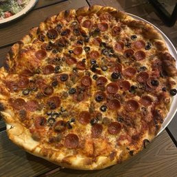 Large pepperoni, sausage, and olive pizza. Large pepperoni, sausage, and olive pizza.