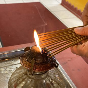 Kwan Ying Buddhist Temple - Lighting 12 incense sticks for prayer - Buddhist Temples Near Me - Los Angeles, California