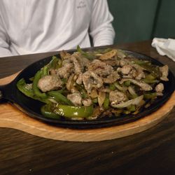 Maria's Mexican - Fajitas sizzling plate, comes with condiments, 3 homemade corn tortillas and side of rice and beans