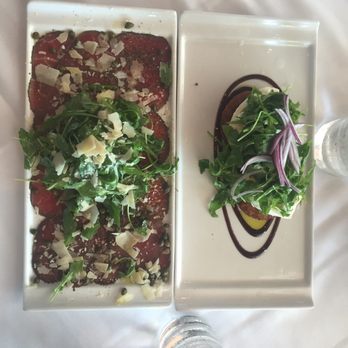 Latitudes - Sunset Key Cottages - Beef carpaccio on the left. burratta and fried green tomato on the right - Seafood Near Me - Key West, Florida Latitudes - Sunset Key Cottages - Beef carpaccio on the left. burratta and fried green tomato on the right - Seafood Near Me - Key West, Florida