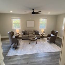 Broad Ripple Construction - Removed built in shelves to open space, drywall, painting, new floor and trim, installed new can lights and ceiling fan