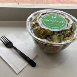 Salad craft blend with grilled pesto chicken and garlic Caesar dressing