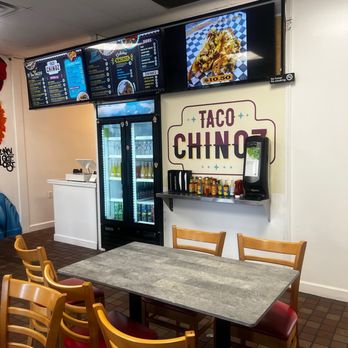 Taco Chinoz - a table and chairs in a restaurant - Tacos Near Me - Manassas, Virginia Taco Chinoz - a table and chairs in a restaurant - Tacos Near Me - Manassas, Virginia