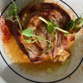 Rigo - Josper Grilled Porchetta- pork belly stuffed with rosemary, garlic, thyme.  Served w/potato puree and white butter sauce - Spanish Near Me - Honolulu, Hawaii