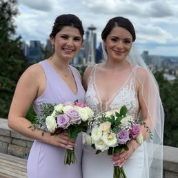 Bridesmaid flowers matching our lilac, plum, ivory theme Bridesmaid flowers matching our lilac, plum, ivory theme