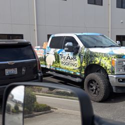 Peaks NW Roofing - The business working on the roof