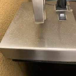 Dusty lamp next to bed