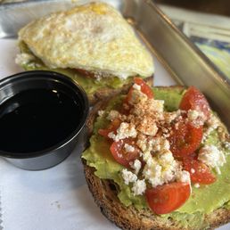 Avocado toast with one fried egg. Avocado toast with one fried egg.