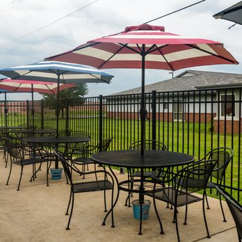 T's Liquor Lane - tables and umbrellas outside - Beer, Wine & Spirits Near Me - Union, Missouri T's Liquor Lane - tables and umbrellas outside - Beer, Wine & Spirits Near Me - Union, Missouri