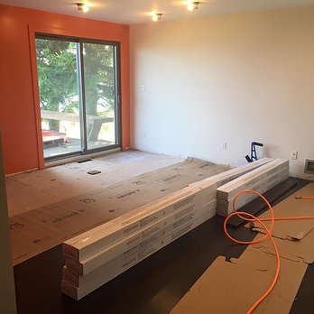 Upswing Flooring - an empty room with a large window - Flooring Near Me Upswing Flooring - an empty room with a large window - Flooring Near Me