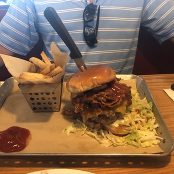 Chili's - a man sitting at a table with a tray of food - Tex-Mex Near Me - Myrtle Beach, South Carolina
