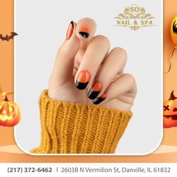 SD Nails & Spa - Get ready to spookify your nails this Halloween with a bewitching combo of orange and black - it's a match made in nail art heaven!