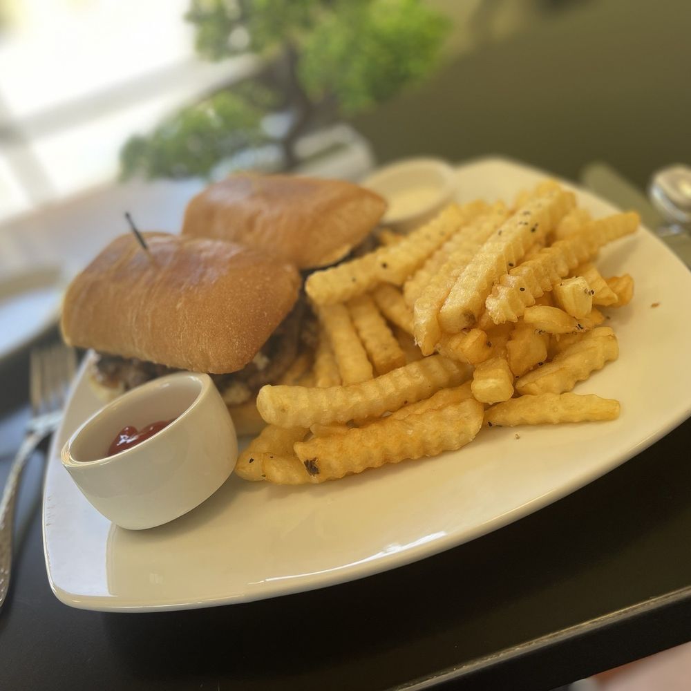 Blue Cheese Steak sandwich with a side of fries. Blue Cheese Steak sandwich with a side of fries.