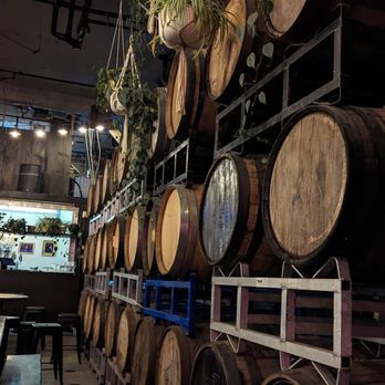 Blood Brothers Brewing - a row of oak barrels - Breweries Near Me - Toronto, Ontario Blood Brothers Brewing - a row of oak barrels - Breweries Near Me - Toronto, Ontario