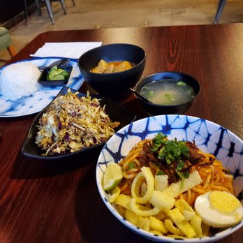 Urban Burma - Back to front: Chicken curry with potatoes, tea leaf salad, and nan gyi dok - Burmese Near Me - Aurora, Colorado Urban Burma - Back to front: Chicken curry with potatoes, tea leaf salad, and nan gyi dok - Burmese Near Me - Aurora, Colorado
