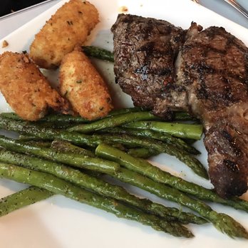 Rino's Place - Ribeye with potato croquettes and asparagus - Italian Near Me - Boston, Massachusetts Rino's Place - Ribeye with potato croquettes and asparagus - Italian Near Me - Boston, Massachusetts