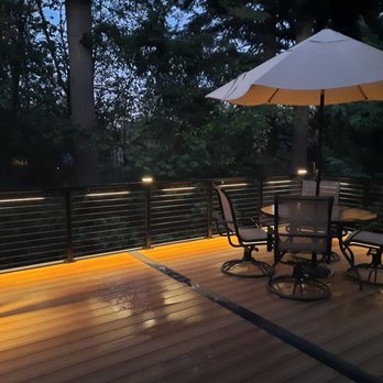 Fence Butler - Deckorators: Voyage Sedona (main) Dark slate zipper trim Steel cable railing/alum. posts LED post caps In-lite 22" undermount light bars - Fences & Gates Near Me