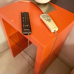 America del Sur - Private Bed/Bath- TV remote control and air conditioner remote literally chained to a table