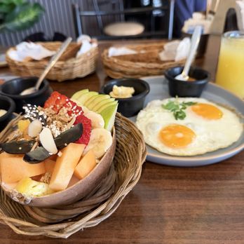 Asia Caribe - Fried eggs over medium, toast and yogurt with fruit bowl. - Chinese Near Me - Isla Mujeres, ROO Asia Caribe - Fried eggs over medium, toast and yogurt with fruit bowl. - Chinese Near Me - Isla Mujeres, ROO