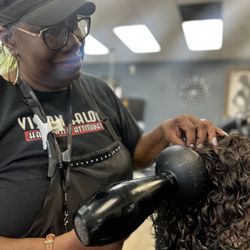 Vision Salon - Regina doing a Purple/Orange rod perm
