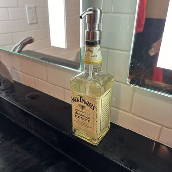 Federal American Grill - This was in the ladies room. Super cute to dispense hand soap. - New American Near Me - Oak Ridge North, Texas