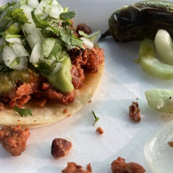 Tacos Estilo Sonora - Oh yeah, just a shot of that backside cause...wow.  Hot and green sauce to add with avocado onions and cilantro...you know it's good. - Tacos Near Me - Perris, Arizona