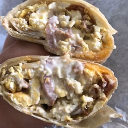 Armandos breakfast burrito with sour cream