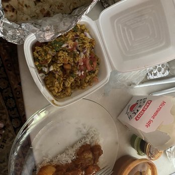 Jalsa - Bhel puri is in the container on the plate is chicken vindaloo and rice on side is tamarind and mint chutney and nann in the foil - Indian Near Me - Carnegie, Pennsylvania Jalsa - Bhel puri is in the container on the plate is chicken vindaloo and rice on side is tamarind and mint chutney and nann in the foil - Indian Near Me - Carnegie, Pennsylvania
