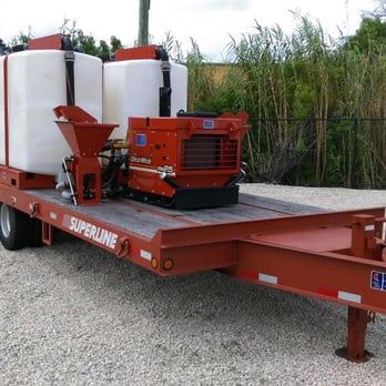 Earth View - a flatbed trailer with a tank on the back - General Contractors Near Me - Naples, Florida Earth View - a flatbed trailer with a tank on the back - General Contractors Near Me - Naples, Florida