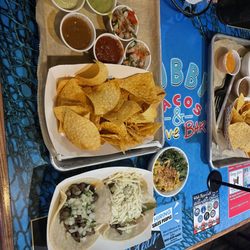 Chips with Salsa from the Salsa Bar, Mexican Street Corn, Steak Fajita Taco & Carne Asada Taco