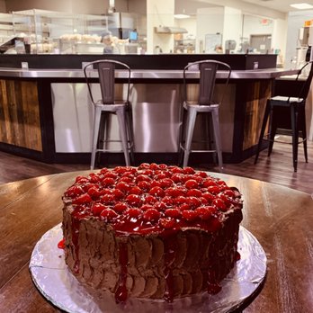 Pocketstone - a chocolate cake on a wooden table - Bakeries Near Me - Farmington, New Mexico