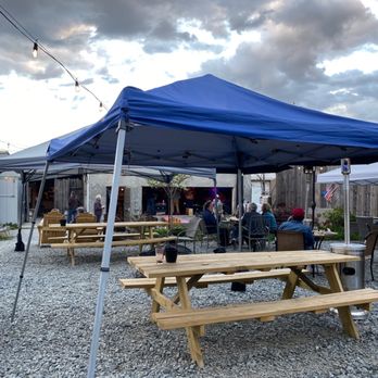 185 King Street - Back patio with tons of outdoor seating! Great spot to listen to the music on stage. - Music Venues Near Me - Brevard, North Carolina