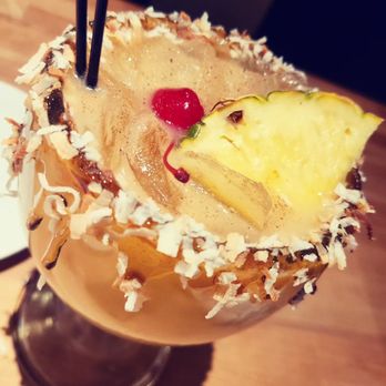 Cheddar's Scratch Kitchen - Painkiller drink it had hints of coconut - Comfort Food Near Me - Glendale, Arizona Cheddar's Scratch Kitchen - Painkiller drink it had hints of coconut - Comfort Food Near Me - Glendale, Arizona