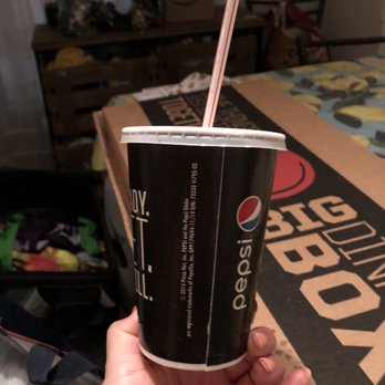 Pizza Hut - a hand holding a cup with a straw - Pizza Near Me - Coachella, California