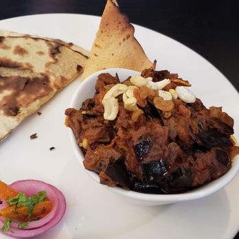 Moksha Indian Bistro - Kalongi bengan (C$16). Good, but I didn't like the raisins in it. Small portion for the price, but that's Niagara. - Indian Near Me - Niagara Falls, Ontario
