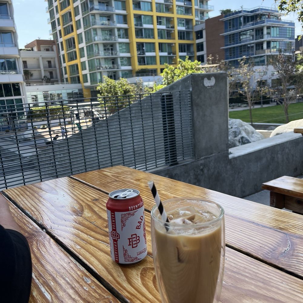 Izola - Beer that came with the carnitas combo, iced coffee with caramel and oat milk - Bakeries Near Me - San Diego, California