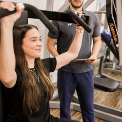 The Exercise Coach - Bentonville - Overhead Press and Pulldown Machine