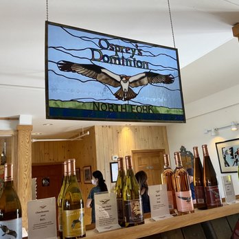 Ospreys Dominion Vineyards - a bar with bottles of wine - Wineries Near Me - Peconic, New York Ospreys Dominion Vineyards - a bar with bottles of wine - Wineries Near Me - Peconic, New York